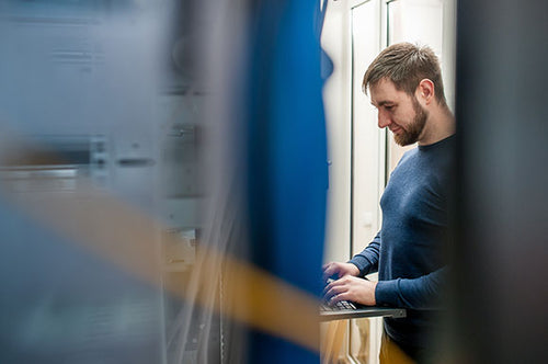 Information technology worker installing software