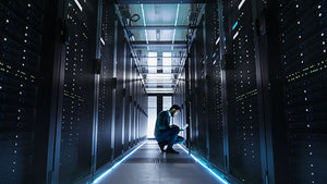 Cybersecurity professional working in server room