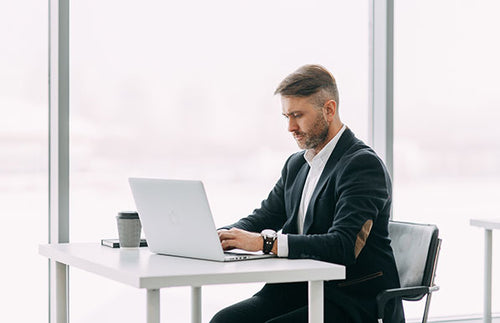 Compliance employee examining trade documents