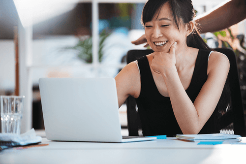 Compliance practitioner working on her computer.