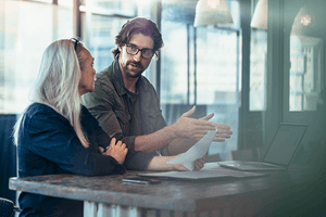 Workers discussing business plan 