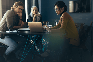 Individuals working around a computer