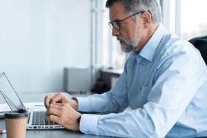 Man working on computer at desk