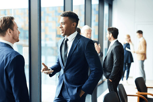 Businessman conversing with his colleague 