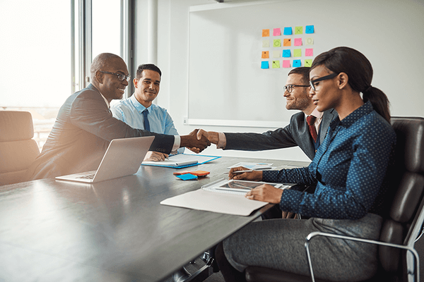 Team of businesspeople discussing marketing strategy in a conference room