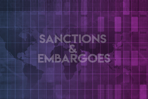 Sanctions and embargoes text on colored background